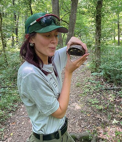 Holly Butcher holding a turtle